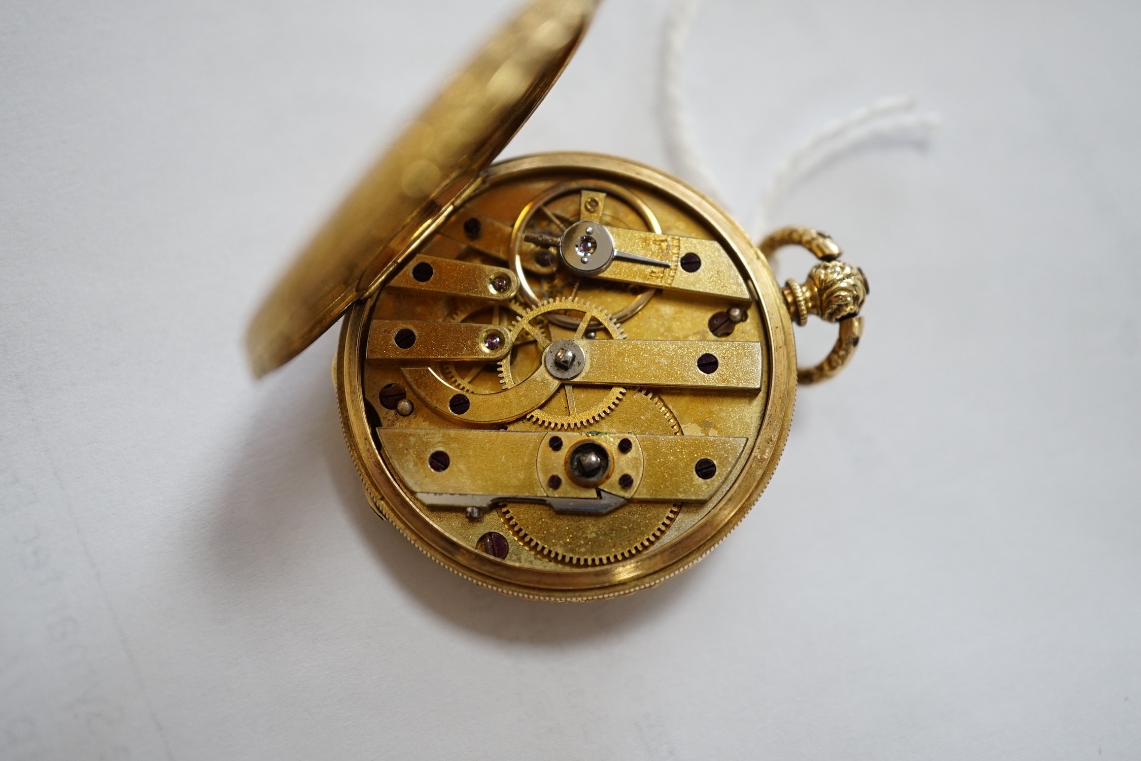 An early 20th century Swiss 18k and enamelled fob watch, decorated with the bust of a young girl and flowers verso, case diameter 33mm, gross weight 27.3 grams.